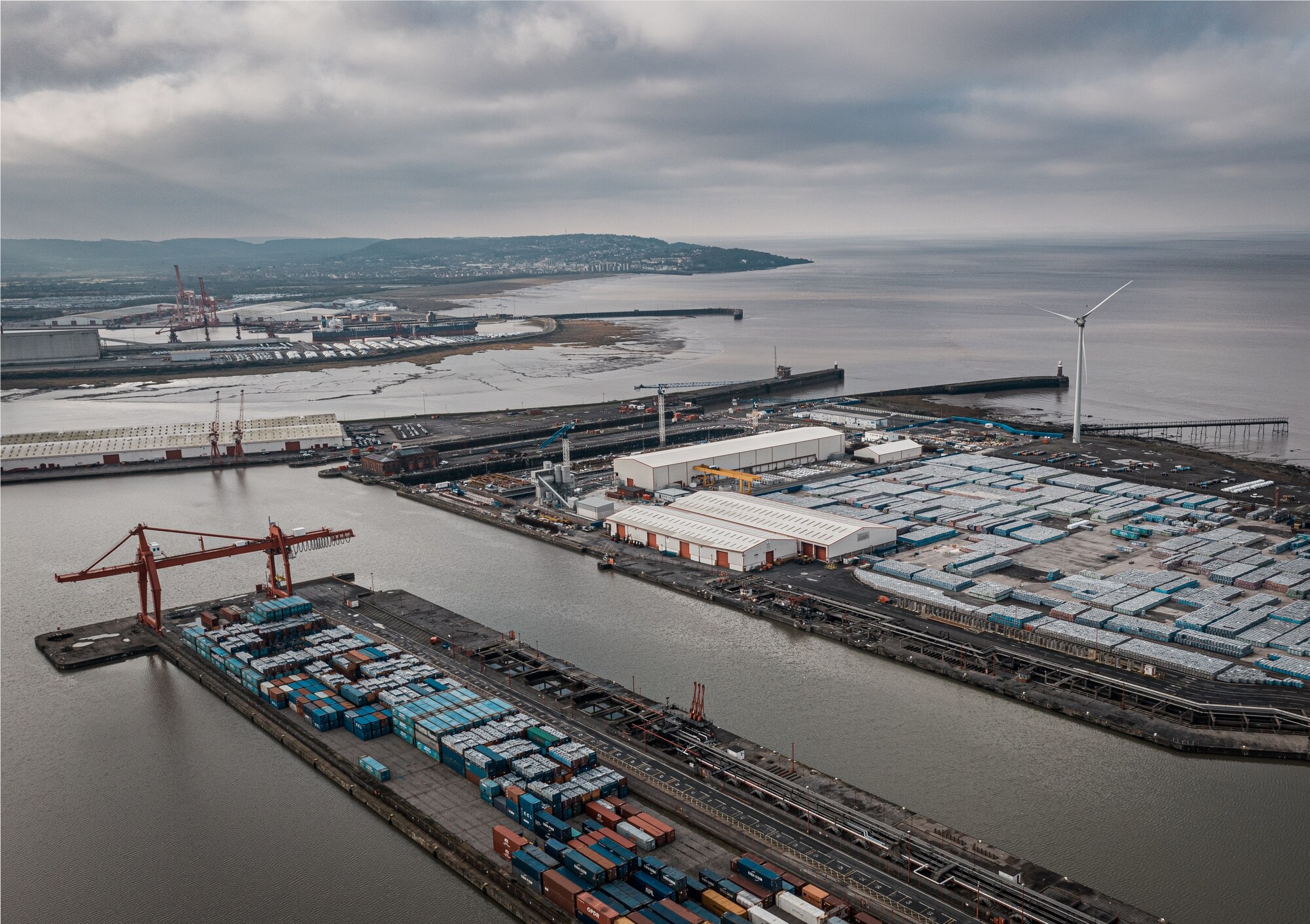 aerial-shot-industrial-seaport-cloudy-sky_181624-29022